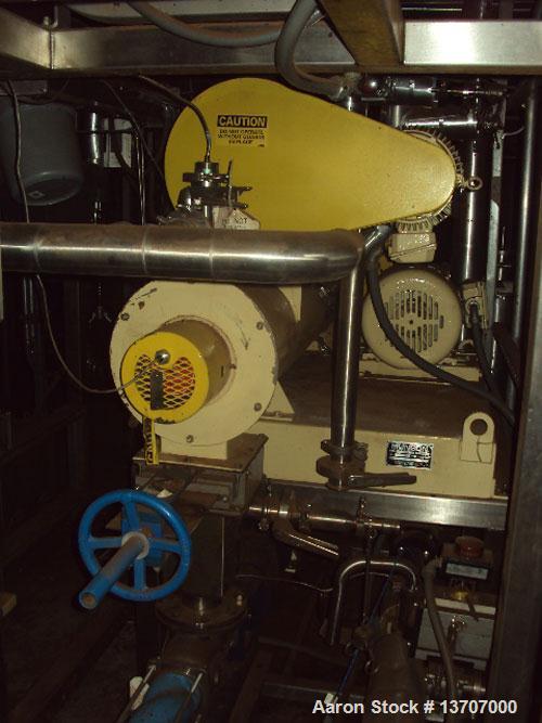 Used Munson Mixer, Model HIM-83/124 SS. Mixing chamber 4' long x 12" deep, 20 hp main drive, feeder 33" long x 9" deep, 10 hp, mixing liquids and solids. Includes (2) Schenck Accu Rate feeders, (1) l...