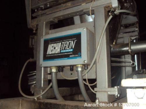 Used Munson Mixer, Model HIM-83/124 SS. Mixing chamber 4' long x 12" deep, 20 hp main drive, feeder 33" long x 9" deep, 10 hp, mixing liquids and solids. Includes (2) Schenck Accu Rate feeders, (1) l...