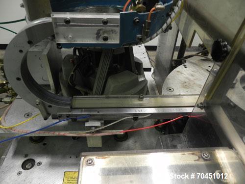 Used Haumiller model 3400 Stainless Steel (6) Pocket Spray Tip Applicator. Single Hammer, 16” vibratory feeder bowl. Approximate 24” x 24” x 12” deep hopper. Allen Bradley Panel View 1000