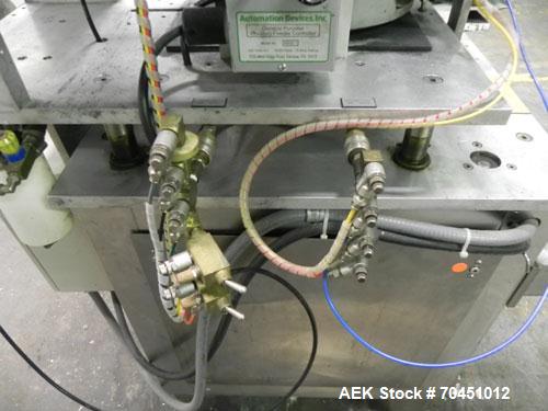Used Haumiller model 3400 Stainless Steel (6) Pocket Spray Tip Applicator. Single Hammer, 16” vibratory feeder bowl. Approximate 24” x 24” x 12” deep hopper. Allen Bradley Panel View 1000