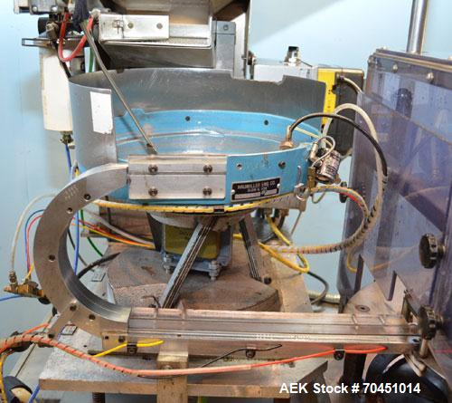 Used Haumiller Model S-Lasta Stainless Steel (6) Pocket Spray Tip Applicator. Single Hammer, 16” vibratory feeder bowl. Approximate 24” x 24” x 12” deep hopper. Allen Bradley Panel View 1000.