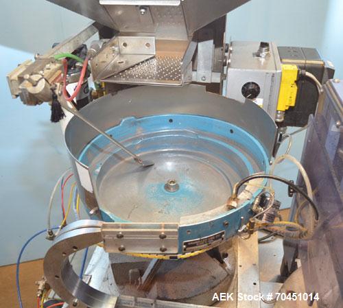 Used Haumiller Model S-Lasta Stainless Steel (6) Pocket Spray Tip Applicator. Single Hammer, 16” vibratory feeder bowl. Approximate 24” x 24” x 12” deep hopper. Allen Bradley Panel View 1000.