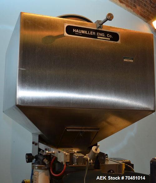Used Haumiller Model S-Lasta Stainless Steel (6) Pocket Spray Tip Applicator. Single Hammer, 16” vibratory feeder bowl. Approximate 24” x 24” x 12” deep hopper. Allen Bradley Panel View 1000.