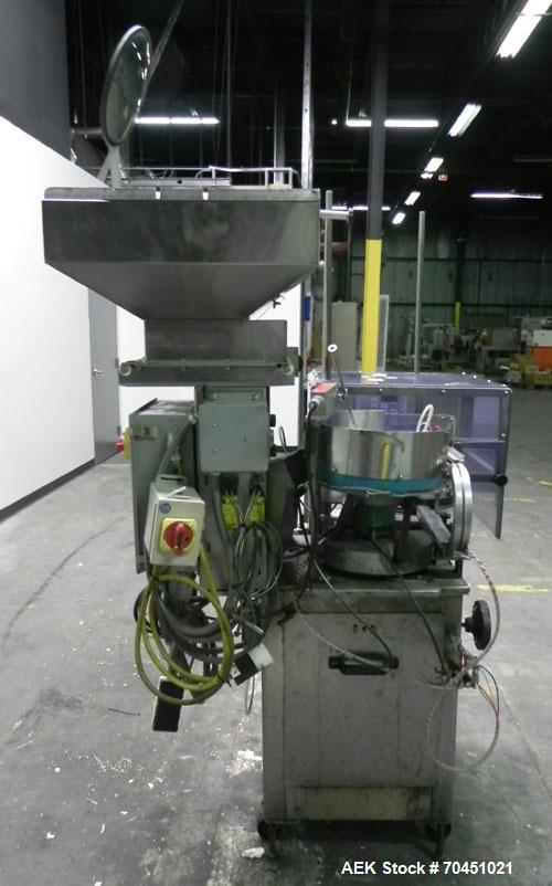 Used Haumiller Model Lasta Stainless Steel 6-Pocket Spray Tip Applicator. Single Hammer, 16” vibratory feeder bowl. Approximate 24” x 24” x 12” deep hopper. Allen Bradley Panel View 1000.