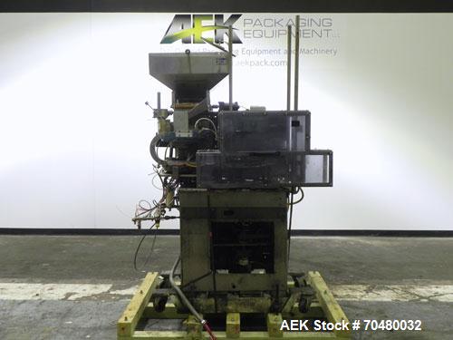 Used Haumiller Model Lasta Stainless Steel 6-Pocket Spray Tip Applicator. Machine is rated at up to 150 parts per minute. Single Hammer configuration 4.5" radius. Has a 16” vibratory feeder bowl. App...