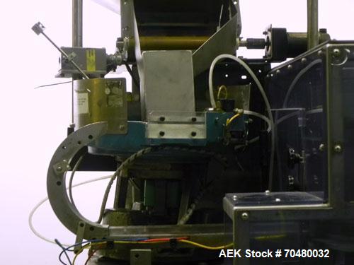 Used Haumiller Model Lasta Stainless Steel 6-Pocket Spray Tip Applicator. Machine is rated at up to 150 parts per minute. Single Hammer configuration 4.5" radius. Has a 16” vibratory feeder bowl. App...