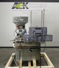 Used Haumiller Stainless Steel (6) Pocket Spray Tip Applicator. Single Hammer, 16” vibratory feeder bowl. Approximate 24” x 24” x 12” deep hopper. Allen Bradley Panel View 1000.