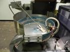 Used Haumiller Model Lasta Stainless Steel 6-Pocket Spray Tip Applicator. Single Hammer, 16” vibratory feeder bowl. Approximate 24” x 24” x 12” deep hopper. Allen Bradley Panel View 1000.