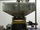Used Haumiller Model Lasta Stainless Steel 6-Pocket Spray Tip Applicator. Single Hammer, 16” vibratory feeder bowl. Approximate 24” x 24” x 12” deep hopper. Allen Bradley Panel View 1000.