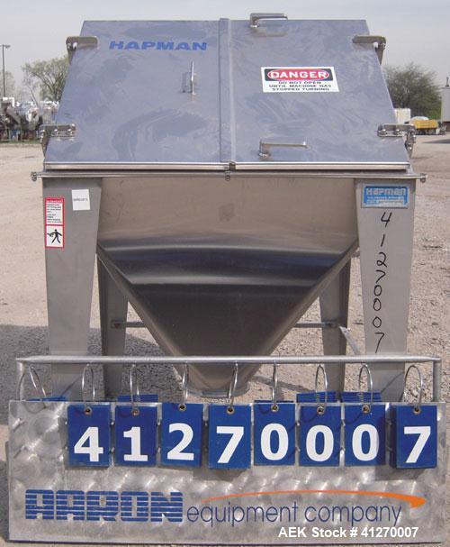 Used Hapman Non-Filtered Bag Dump Station, 304 stainless steel. Dump area 36" wide x 36" deep, hinged front door, 6’’ back opening, no product grate. Coned bottom hopper, 8" outlet. Mounted on 4 stai...