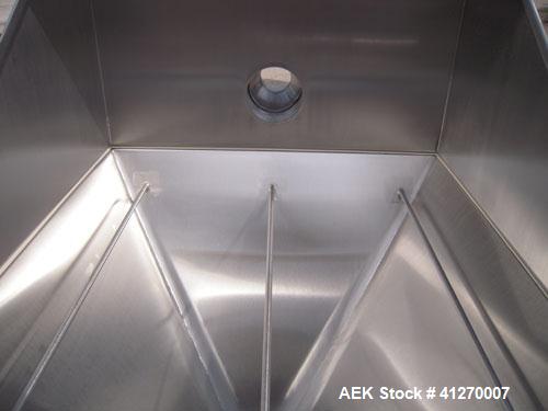 Used Hapman Non-Filtered Bag Dump Station, 304 stainless steel. Dump area 36" wide x 36" deep, hinged front door, 6’’ back opening, no product grate. Coned bottom hopper, 8" outlet. Mounted on 4 stai...