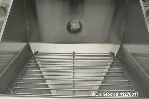 Used Hapman Bag Break/ Dump Station, 304 Stainless Steel. Dump area 36" long x 36" wide x 16" high x 28" cone. Hinged front doors and product grate. 8" bottom outlet. Mounted on 4 stainless steel leg...