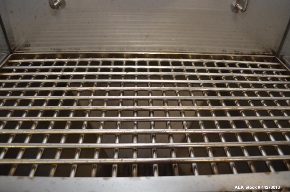 Used Hapman Vibrating Dump Station, Stainless Steel. Includes a Dust Collector. Approximate 30” long x 16” wide x 37” high dump area with grate. Dust Collector with Pulsing Air System for Cleaning Fi...