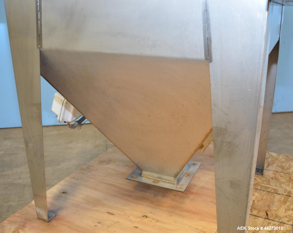Used Hapman Vibrating Dump Station, Stainless Steel. Includes a Dust Collector. Approximate 30” long x 16” wide x 37” high dump area with grate. Dust Collector with Pulsing Air System for Cleaning Fi...