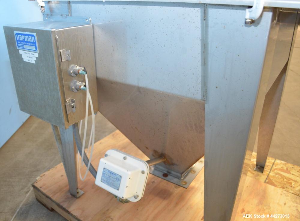 Used Hapman Vibrating Dump Station, Stainless Steel. Includes a Dust Collector. Approximate 30” long x 16” wide x 37” high dump area with grate. Dust Collector with Pulsing Air System for Cleaning Fi...