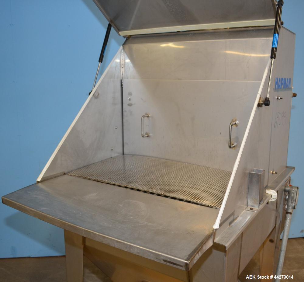 Used Hapman Vibrating Dump Station, Stainless Steel. Includes a Dust Collector. Approximate 30” long x 16” wide x 37” high dump area with grate. Dust Collector with Pulsing Air System for Cleaning Fi...