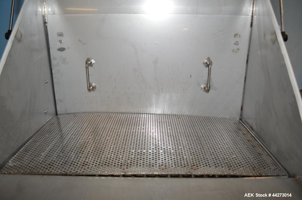Used Hapman Vibrating Dump Station, Stainless Steel. Includes a Dust Collector. Approximate 30” long x 16” wide x 37” high dump area with grate. Dust Collector with Pulsing Air System for Cleaning Fi...