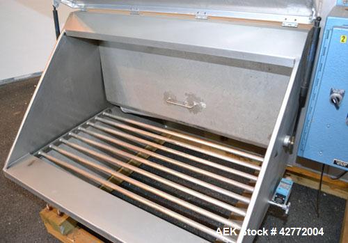 Used Young Industries Filtered Bag Dump Station, Size FBD 42-8. 304 Stainless Steel. 45’’ Wide  x 24’’ deep dump area. (7) Filter cages, (1) top mounted blower, driven by a 1-1/2 hp, 3/60/230/460 vol...