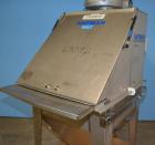 Used Hapman Vibrating Dump Station, Stainless Steel. Includes a Dust Collector. Approximate 30” long x 16” wide x 37” high dump area with grate. Dust Collector with Pulsing Air System for Cleaning Fi...
