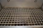 Used Hapman Vibrating Dump Station, Stainless Steel. Includes a Dust Collector. Approximate 30” long x 16” wide x 37” high dump area with grate. Dust Collector with Pulsing Air System for Cleaning Fi...