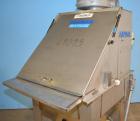 Used Hapman Vibrating Dump Station, Stainless Steel. Includes a Dust Collector. Approximate 30” long x 16” wide x 37” high dump area with grate. Dust Collector with Pulsing Air System for Cleaning Fi...