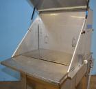 Used Hapman Vibrating Dump Station, Stainless Steel. Includes a Dust Collector. Approximate 30” long x 16” wide x 37” high dump area with grate. Dust Collector with Pulsing Air System for Cleaning Fi...