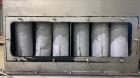 Used Vac-U-Max XP Stainless Steel Bag Dump Station with integrated dust collection and empty bag compaction. Top mount blower, 6 bags. Hydraulically operated bag compactor.