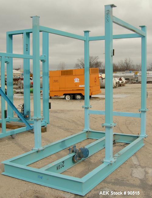 Used: Taylor Products bulk bag discharger, model DW-1000, approximate 2000 pound capacity. Includes a 54" diameter vibrating pan with bag holder, vibrating motor, and a Demag hoist with bag holder. F...