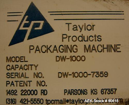 Used: Taylor Products bulk bag discharger, model DW-1000, approximate 2000 pound capacity. Includes a 54" diameter vibrating pan with bag holder, vibrating motor, and a Demag hoist with bag holder. F...