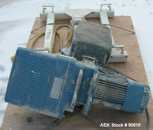 Used: Taylor Products bulk bag discharger, model DW-1000, approximate 2000 pound capacity. Includes a 54" diameter vibrating pan with bag holder, vibrating motor, and a Demag hoist with bag holder. F...
