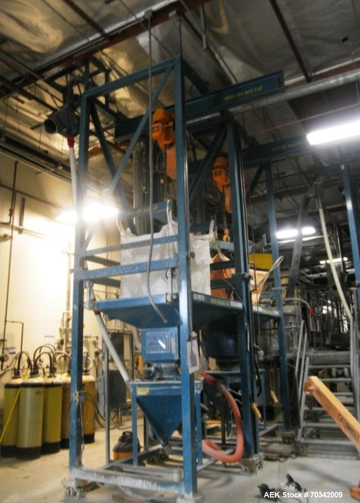 Used Vibra Screw Bulk Bag Supersack Unloader. Includes overhead traveling hoist for bags rated for 4,000 pounds maximum capacity. Heavy duty frame, bag support hopper, vibration discharge system, mil...