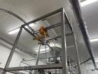 Used- Flexicon Super Sack Unloading Frame With Hoist. Stainless Steel. Unit is currently installed.