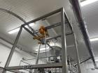 Used Flexicon Super Sack Unloading Frame With Hoist. Stainless Steel. Unit is currently installed and customer would be responsible for removal
