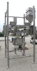Used Super Sack Unloader, 304 Stainless Steel. (1) Frame with top height adjustment, 1 bag holder I beam ( no hoist), (2) bag valves. Includes (3) Flexicon screw conveyor drive ends (no tubes or scre...