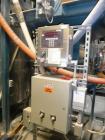 Used Vibra Screw Bulk Bag Supersack Unloader. Includes overhead traveling hoist for bags rated for 4,000 pounds maximum capacity. Heavy duty frame, bag support hopper, vibration discharge system, mil...