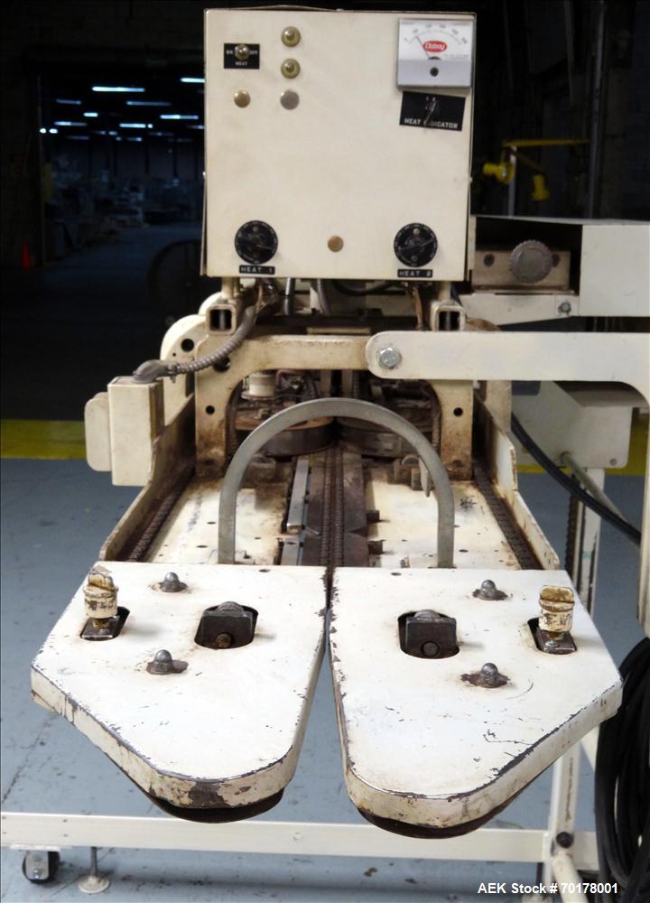 Used Doboy Model CBS-CH Continuous Band Sealer. Machine can perform at variable speeds from 300" - 425" per minute. The CBS-CH is chain fed for high volume, continuous production. Machine has a maxim...