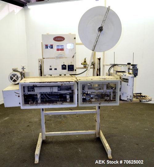 Used Doboy Model PT Pinch Bottom Bag Sealer. Up to 30 bags per minute. Designed for multiwall bags with heat-sealable inner liners. Sews bags, trims tops, applies pre-coated heat-sealable tape, and i...