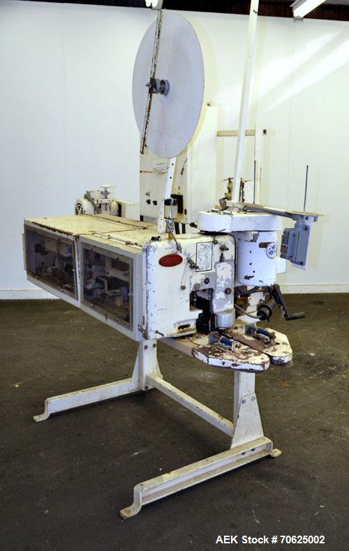 Used Doboy Model PT Pinch Bottom Bag Sealer. Up to 30 bags per minute. Designed for multiwall bags with heat-sealable inner liners. Sews bags, trims tops, applies pre-coated heat-sealable tape, and i...