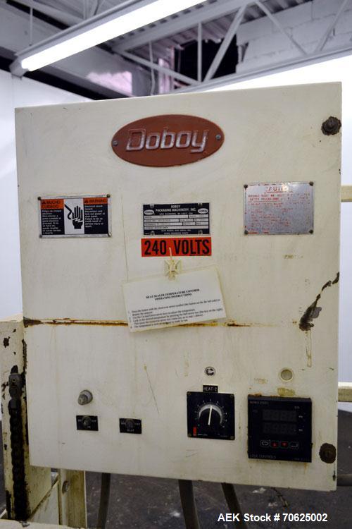 Used Doboy Model PT Pinch Bottom Bag Sealer. Up to 30 bags per minute. Designed for multiwall bags with heat-sealable inner liners. Sews bags, trims tops, applies pre-coated heat-sealable tape, and i...
