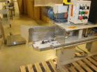 USED: Fischbein DRC200 single or double fold hot melt bag sealercapable of running at speeds up to 60' per minute. Has Nordson hotmelt glue system. Pinch bottom bag sealer has a bag size range of5