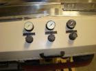USED: Fischbein DRC200 single or double fold hot melt bag sealercapable of running at speeds up to 60' per minute. Has Nordson hotmelt glue system. Pinch bottom bag sealer has a bag size range of5