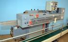 Used Altivity Packaging Model 901 Band Sealer / Closer. Designed for bags, approximate 48” long band length. With horizontal rubber belt take away conveyor in steel frame 12” x 174” long. .230 Volt, ...