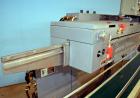 Used Altivity Packaging Model 901 Band Sealer / Closer. Designed for bags, approximate 48” long band length. With horizontal rubber belt take away conveyor in steel frame 12” x 174” long. .230 Volt, ...