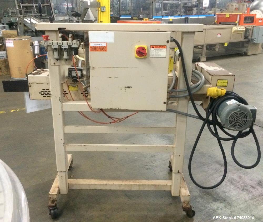 Used Fischbein Model PBC 5600  Hot Air Pinch Bottom Bag Sealer for bags with pre-applied glue. Capble of speeds up to 85 feet per minute.    Has an empty bag size range: (Width) 12" - 20" or 304mm - ...
