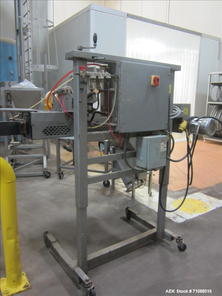Used Fischbein Model PBC 5600  Hot Air Pinch Bottom Bag Sealer fo rbags with pre-applied glue. Capble of speeds up to 85 feet per minute.  Handles glue flaps up to 2-1/2".  Has an empty bag size rang...