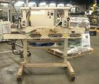 Used Fischbein Model PBC 5600  Hot Air Pinch Bottom Bag Sealer for bags with pre-applied glue. Capble of speeds up to 85 feet per minute.    Has an empty bag size range: (Width) 12