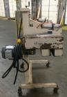 Used Fischbein Model PBC 5600  Hot Air Pinch Bottom Bag Sealer for bags with pre-applied glue. Capble of speeds up to 85 feet per minute.    Has an empty bag size range: (Width) 12