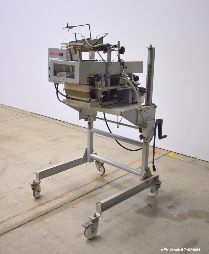 Used Bosch Doboy Semi-Automatic Bag Top Labeler, Model JSL.  Heat seals a paper header label to the top of a premade bag.  Speed up to 30 bags / minute.  Label Width: 2.5" - 9.5" (6.35 - 24.13 cm); U...