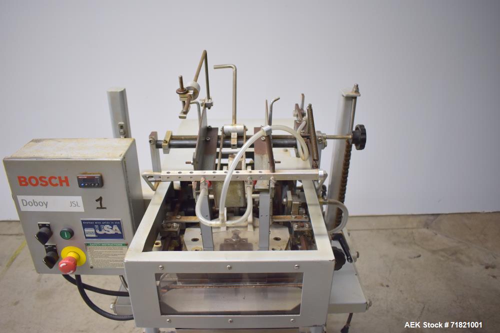 Used Bosch Doboy Semi-Automatic Bag Top Labeler, Model JSL.  Heat seals a paper header label to the top of a premade bag.  Speed up to 30 bags / minute.  Label Width: 2.5" - 9.5" (6.35 - 24.13 cm); U...