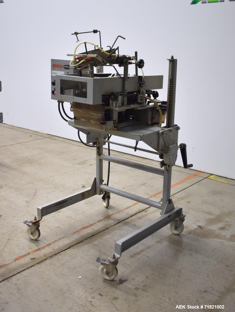Used Bosch Doboy Semi-Automatic Bag Top Labeler, Model JSL.  Heat seals a paper header label to the top of a premade bag.  Speed Up to 30 bags / min.  Label width; 2.5" - 9.5" (6.35 - 24.13 cm), Unfo...